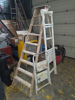 a ladder that is leaning against a wall in a garage