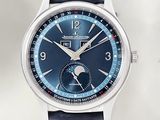 a close up of a wrist watch with a blue dial