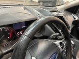 dashboard of a car with a steering wheel and a dash light