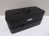 a black suitcase sitting on a white table