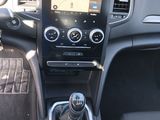 the interior of a car with a steering control and dashboard controls