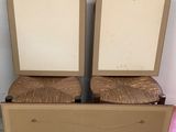 two chairs that are next to each other in a room