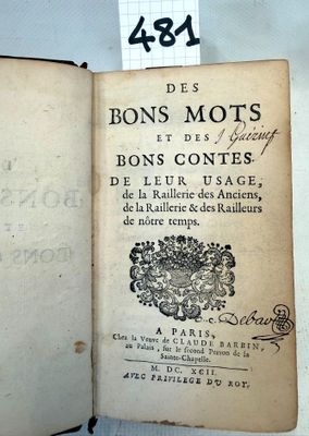 an old book that is open on a table