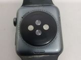 a close up of an apple watch on a white surface