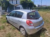 a silver car that is parked in the grass