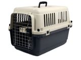 a black and white dog carrier with a door open on a white background