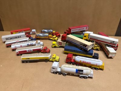a lot of toy trucks that are sitting on a table