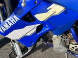 a close up of a yamaha motorcycle parked on the street