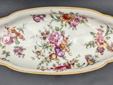 a large serving dish with a floral design on it
