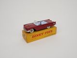 an image of a red toy car sitting on top of a yellow box