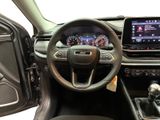 the interior of a car with a steering wheel, dashboard, and a touch screen