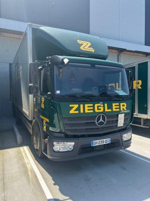 a truck that is parked in front of a building