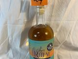a bottle of rum that is sitting on a white sheet