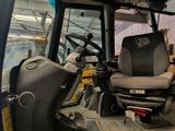 a picture of a tractor with a seat and a steering