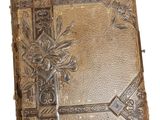 an old book with a decorative design on the cover