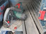 a picture of a cluttered work area with tools and tools