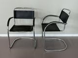 pair of chrome and black leather cantile chairs by marcel knoller for knoller