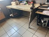 a desk with a computer and a keyboard on it