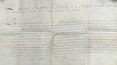 an old document with writing on it sitting on a table