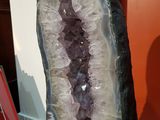 a very large piece of amethorate on a stand