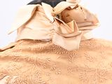 an image of a dress on a mannequin with a bow