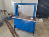 a blue machine that is sitting in the middle of a room