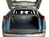 the back of a car with its trunk open showing the cargo compartment