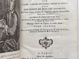 an open book with a picture of a man sitting at a table in front of it