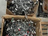 two boxes full of electronic components sitting on the ground