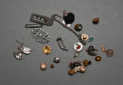 a lot of jewelry that is laying out on the table