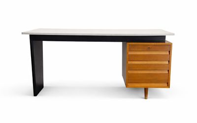 a black and white desk with a wooden drawer underneath it