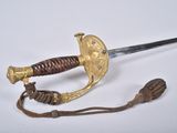 an old sword with a wooden handle and a rope