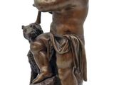 bronze statue of a boy with a dog on a marble base