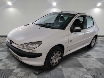 a white car that is parked in a room