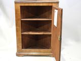 une vieille armoire en bois dont la porte est ouverte, sur fond blanc