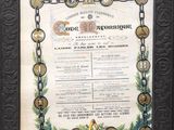 un vieux certificat encadré, orné d'une étoile et d'une chaîne