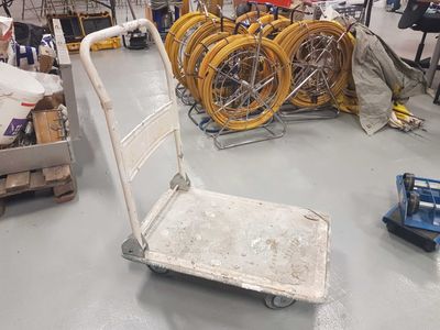 a cart that is sitting on the floor in a warehouse