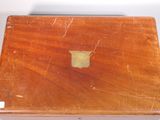 a wooden box that has a small apple logo on it