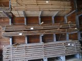 several stacks of wooden planks stacked on top of each other in a room