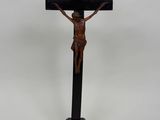 a wooden crucifix with a cross on top of it