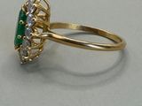 yellow gold ring with emerald and white diamonds