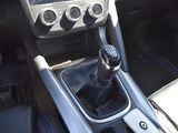 a car dashboard with a gear stick in the center of it