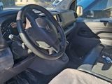 the interior of a car with a steering wheel and a dashboard