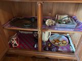a wooden cabinet with a tray of food on top of it