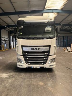 a white truck that is parked in a warehouse