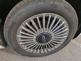 a close up of a tire with a clock on it