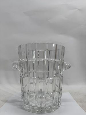 a glass vase that is sitting on a table