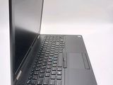 a laptop computer sitting on top of a white table
