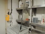 a kitchen with a sink and a lot of dishes in it