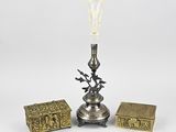 a silver plated lamp with a glass shade and a box